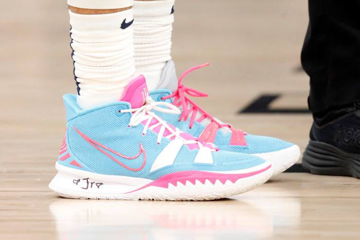 View of blue and pink Nike Kyrie shoes.